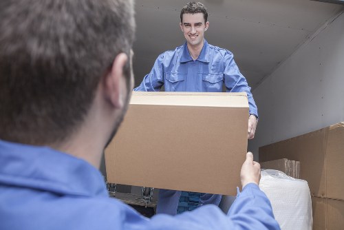 Storage facility team sorting recyclable cardboard and packaging
