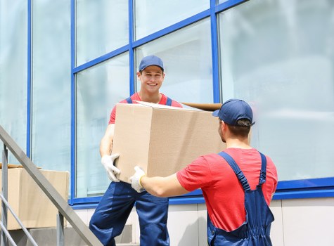 Staff preparing desks and equipment for an office move