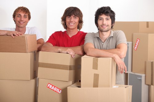 Student packing belongings for storage during term break in Woolwich