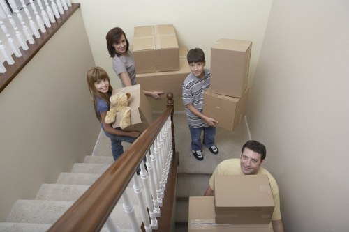 Professional movers packing household items in Woolwich